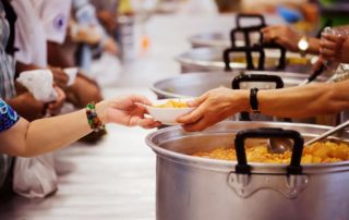 Volunteer Serving Food