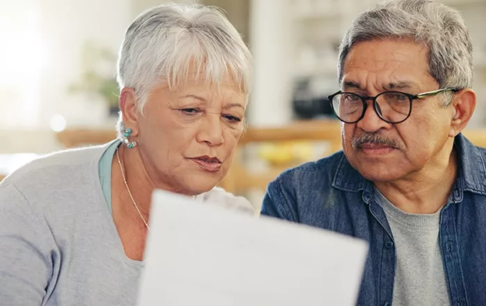 Senior couple reading a document