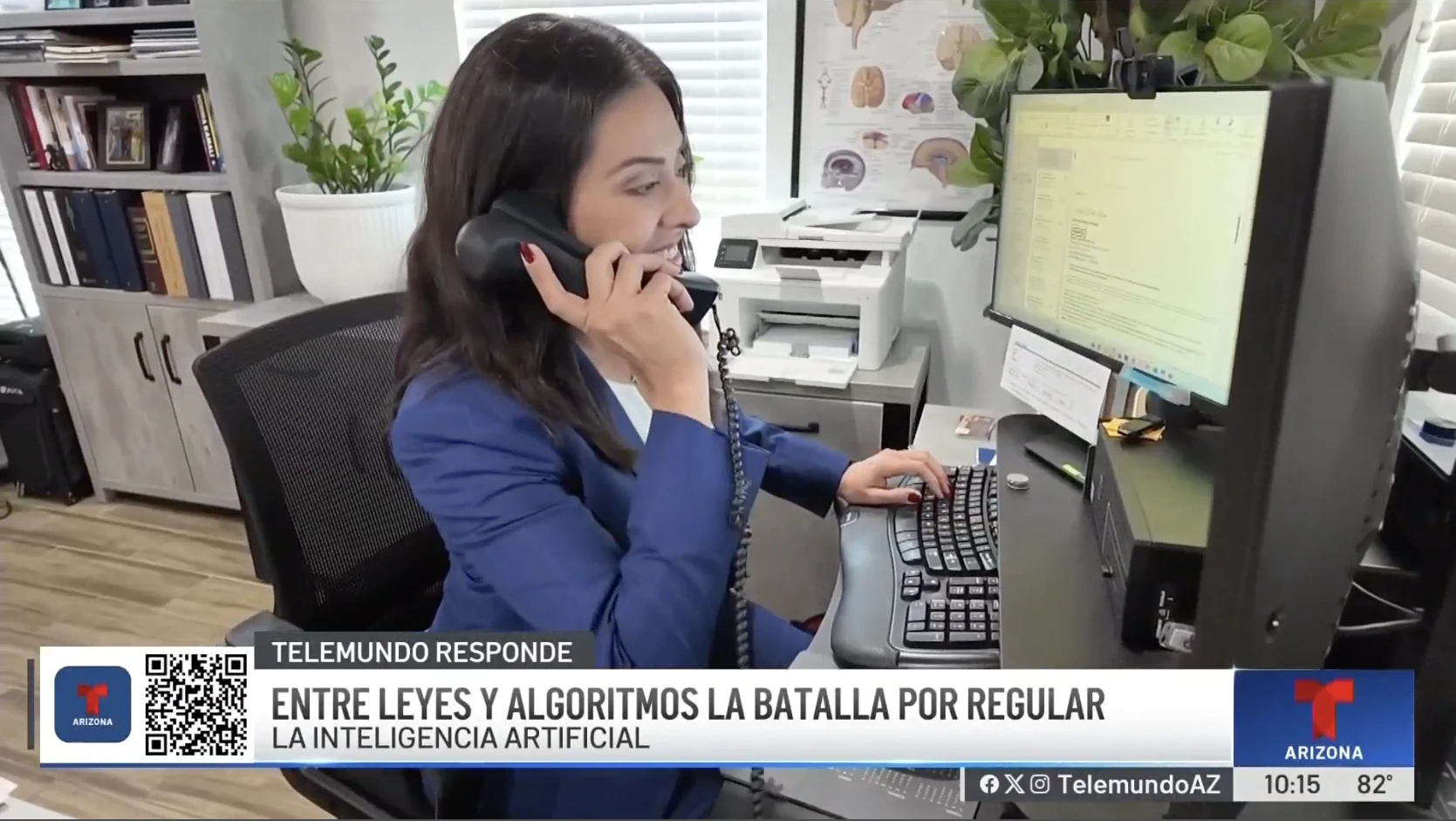 Cristina Pérez Hesano speaking on the phone at her desk during a Telemundo Arizona interview about AI regulation