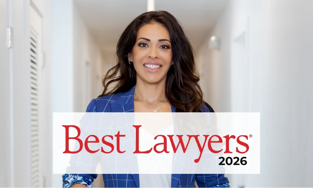 Cristina Perez Hesano smiling in a hallway with a Best Lawyers 2026 banner overlay